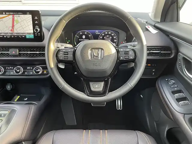 ホンダ ＺＲ－Ｖ ハイブリッド e:HEV Z 福岡県 2024(令6)年 0.6万km クリスタルブラックパール ワンオーナー/BOSEプレミアムサウンド/純正9インチディスプレイオーディオ/　(AM/FM/Bluetooth/フルセグTV/ナビ)/マルチビューカメラ/バック/フロント/サイドカメラ/ホンダセンシング/・衝突軽減ブレーキ/・踏み間違い衝突軽減/・路外逸脱抑制/・歩行者事故低減ステアリング/・先行車発進お知らせ/・標識認識/・オートハイビーム/・アダプティブドライビングビーム/・ブラインドスポットインフォメーション/・パーキングセンサー/・アダプティブクルーズコントロール(渋滞追従機能付)/・車線維持支援/・トラフィックジャムアシスト/横滑り防止/ヒルディセントコントロール/純正18インチアルミホイール/パワーバックドア/パドルシフト/革巻きステアリング/ステアリングスイッチ/ステアリングヒーター/茶色レザーシート/シートメモリー(D)/シートヒーター付きパワーシート(D/N)/コムテック前後ドライブレコーダー【AG425-DRC】/純正ナビ連動型ビルトインETC2.0/純正フロアマット/置くだけ充電/USB端子、タイプC端子/ISOFIX/スペアキー×1/保証書/取扱説明書/ナビ取扱説明書