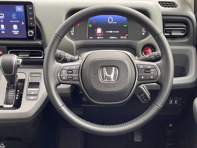 ホンダ フリード ハイブリット e:HEV クロスター 愛知県 2025(令7)年 0.1千km プラチナホワイトパール 登録済未使用車/純正9インチメモリナビ　LXM-242ZFNI/フルセグTV/USB/BT/AM/FM/Apple Car Play/Android Auto/バックカメラ/ハーフレザーシート/シートヒーター　D/N席/ホンダセンシング/衝突軽減ブレーキ（CMBS/車線維持支援システム（LKAS/路外逸脱抑制機能/先行車発進お知らせ機能/渋滞追従機能付アダプティブクルーズコントロール（ACC/オートハイビーム（AHB/誤発進抑制機能/ブラインドスポットインフォメーション（BSI/標識認識/リアクーラー機能/スマートキー/プッシュスタート/ルーフレール/USBポート/革巻きステアリング/LEDオートライト/LEDフォグランプ/電動格納ミラー/純正15インチAW