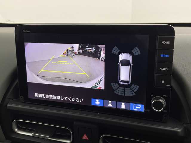 ホンダ フリード ハイブリット e:HEV クロスター 愛知県 2025(令7)年 0.1千km プラチナホワイトパール 登録済未使用車/純正9インチメモリナビ　LXM-242ZFNI/フルセグTV/USB/BT/AM/FM/Apple Car Play/Android Auto/バックカメラ/ハーフレザーシート/シートヒーター　D/N席/ホンダセンシング/衝突軽減ブレーキ（CMBS/車線維持支援システム（LKAS/路外逸脱抑制機能/先行車発進お知らせ機能/渋滞追従機能付アダプティブクルーズコントロール（ACC/オートハイビーム（AHB/誤発進抑制機能/ブラインドスポットインフォメーション（BSI/標識認識/リアクーラー機能/スマートキー/プッシュスタート/ルーフレール/USBポート/革巻きステアリング/LEDオートライト/LEDフォグランプ/電動格納ミラー/純正15インチAW