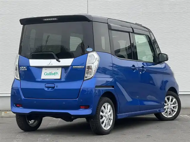 三菱 ｅＫスペース カスタムT セーフティプラスED 秋田県 2018(平30)年 4.2万km ライトニングブルーマイカ 4WD/ターボ/純正メモリナビ/　【フルセグ/CD/DVD/USB/SD/BT/MSV】/バックカメラ・全周囲カメラ/純正エンジンスターター/装着：社外AWスタッドレスタイヤ 155/65/R14/車載：純正AWサマータイヤ 　　　165/55/R15/ステアリングスイッチ/クルーズコントロール/運転席シートヒーター/両側パワースライドドア/LEDヘッドライト（AUTO機能付き）・フォグランプ/オートマチックハイビーム/アイドリングストップ/衝突軽減システム/横滑り防止機能/レーンキープアシスト/パーキングアシスト/コーナーセンサー/リアサーキュレーター/リアサンシェード/純正フロアマット/純正ドアバイザー