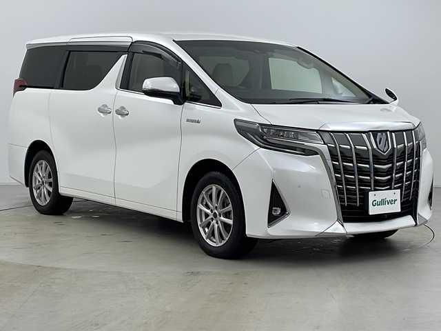 トヨタ アルファードハイブリット X 大分県 2019(令1)年 7.8万km ホワイトパールクリスタルシャイン ・4WD/・寒冷地仕様/・純正ナビ＆CD＆DVD&SD&BT&HDMI&TV&USB/・両側パワースライドドア/・純正デジタルインナーミラー/・レーダークルーズコントロール/・パーキングサポートブレーキ/・レーントレーシングアシスト/・プリクラッシュセーフティ/・クリアランスソナー/・ブラインドスポットモニター/・ロードサインアシスト/・純正フリップダウンモニター/・AC100V1500W/・ステアリングスイッチ/・革調シートカバー/・TVキャンセラー/・社外フロントカメラ/・バックカメラ/・後席カーテン/・純正ドライブレコーダー/・プッシュスタート/・スマートキー/・スペアキー/・ドアミラーヒーター/・社外１７インチAW/・LEDフォグ