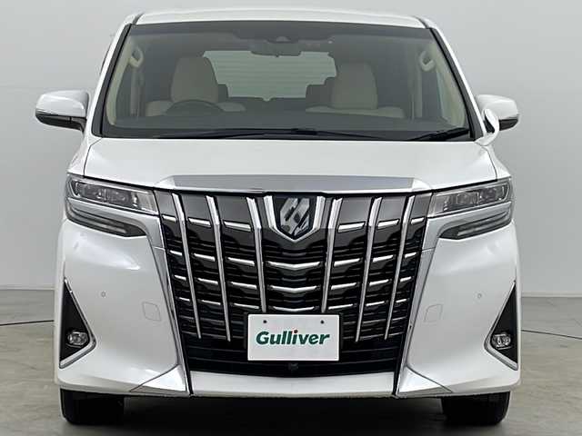 トヨタ アルファードハイブリット X 大分県 2019(令1)年 7.8万km ホワイトパールクリスタルシャイン ・4WD/・寒冷地仕様/・純正ナビ＆CD＆DVD&SD&BT&HDMI&TV&USB/・両側パワースライドドア/・純正デジタルインナーミラー/・レーダークルーズコントロール/・パーキングサポートブレーキ/・レーントレーシングアシスト/・プリクラッシュセーフティ/・クリアランスソナー/・ブラインドスポットモニター/・ロードサインアシスト/・純正フリップダウンモニター/・AC100V1500W/・ステアリングスイッチ/・革調シートカバー/・TVキャンセラー/・社外フロントカメラ/・バックカメラ/・後席カーテン/・純正ドライブレコーダー/・プッシュスタート/・スマートキー/・スペアキー/・ドアミラーヒーター/・社外１７インチAW/・LEDフォグ
