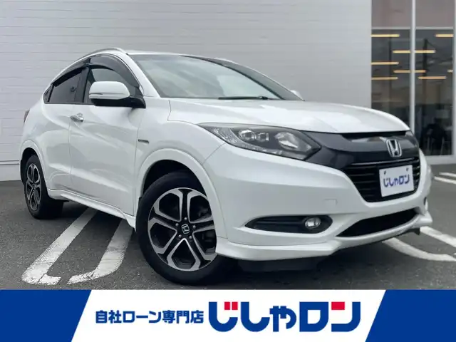 ホンダ ヴェゼル ハイブリッド Z 熊本県 2014(平26)年 10.4万km ホワイトオーキッドパール (株)IDOMが運営する【じしゃロン熊本店】の自社ローン専用車両になります/こちらは現金またはオートローンご利用時の価格です。自社ローンご希望の方は別途その旨お申付け下さい./社外ナビ/バックカメラ/クルーズコントロール/LEDヘットライト/ハーフレザーシート/シートヒーター