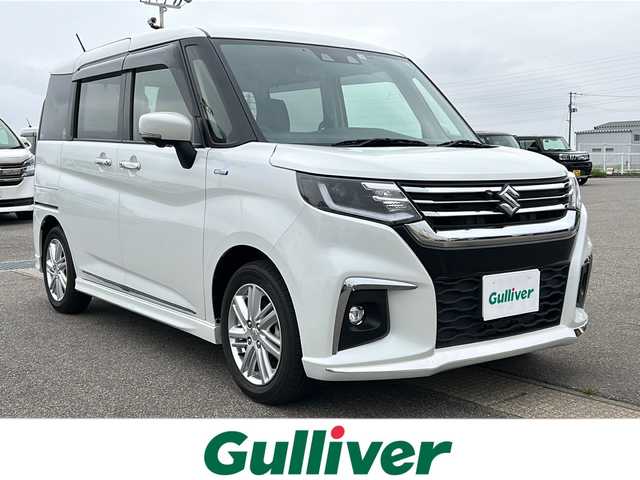 スズキ ソリオ HV MZ 新潟県 2022(令4)年 0.4万km ピュアホワイトP ワンオーナー/ヘッドアップディスプレイ/ハイブリット/純正ナビ/シートヒーター/クルーズコントロール追従あり/両側パワースライド/全方位カメラ/純正アルミホイール/コーナーセンサー/LEDヘッドライト/衝突軽減システム/スマートキー/プッシュスタート