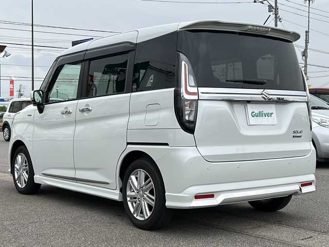 スズキ ソリオ HV MZ 新潟県 2022(令4)年 0.4万km ピュアホワイトP ワンオーナー/ヘッドアップディスプレイ/ハイブリット/純正ナビ/シートヒーター/クルーズコントロール追従あり/両側パワースライド/全方位カメラ/純正アルミホイール/コーナーセンサー/LEDヘッドライト/衝突軽減システム/スマートキー/プッシュスタート