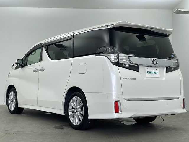 トヨタ ヴェルファイア Z 鹿児島県 2016(平28)年 5.8万km ホワイトパールクリスタルシャイン メーカーOPナビ/(BT/CD/DVD/AM/FM/フルセグTV)/純正フリップダウンモニター/電動パーキングブレーキ/オートホールド/バックカメラ/MTモード付AT/純正ビルトインETC/社外前方のみドライブレコーダー/両側パワースライドドア/純正18インチアルミホイール/前後コーナーセンサー/革巻きウッドステアリング/ステアリングスイッチ/純正ドアバイザー/フロントフォグライト/スペアキー