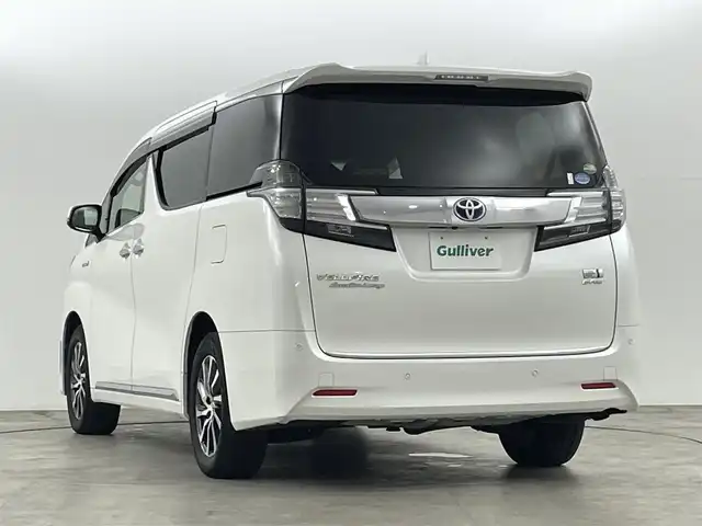 トヨタ ヴェルファイア ハイブリット エグゼクティブ ラウンジ 大阪府 2016(平28)年 5.1万km ホワイトパールクリスタルシャイン トヨタセーフティーセンス　/・クリアランスソナー/・ＰＣＳ/・レーダークルーズコントロール/・車線逸脱警報/純正ナビ　/ＪＢＬサウンド　/全方位カメラ/ＥＴＣ　/フリップダウンモニター　/電子パーキング　/ブレーキホールド　/シートヒーター　/・ハンドルヒーター　/オービスレーダー/両側パワースライドドア　/レザーシート/ステアリングスイッチ/・革巻きステアリング/・チルトステアリング/ドライブレコーダー/ＡＣ１００Ｖ/プッシュスタート/・スマートキー/LEDライト/・オートライト/・フォグライト/オットマン/ウィンカーミラー