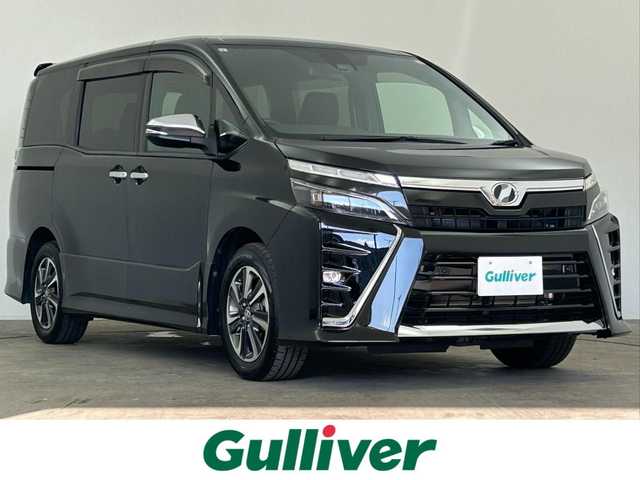 トヨタ ヴォクシー ZS 煌Ⅱ 千葉県 2019(令1)年 6.1万km イナズマスパーキングブラックガラスフレーク 禁煙車/トヨタセーフティセンス/・レーンディパーチャーアラート/・プリクラッシュセーフティブレーキ/・クリアランスソナー/・クルーズコントロール/両側パワースライドドア/純正９型メモリナビ/・型番：NSZT-Y68T/・CD/DVD/Bluetooth/フルセグTV/・バックカメラ/・ビルトインETC/革巻きステアリング/・ステアリングスイッチ/MT付きAT/左右独立エアコン/純正フロアマット/純正16インチAW/オートライト/・オートマチックハイビーム/・LEDヘッドライト/・LEDフォグランプ