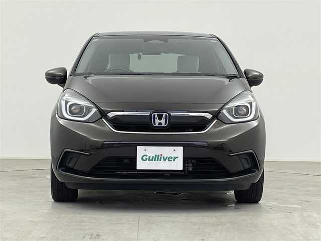 ホンダ フィット e:HEVホーム 千葉県 2021(令3)年 3.7万km プレミアムグラマラスブロンズP Honda SENSING/・衝突軽減ブレーキ/・誤発進抑制制御/・先行車発進告知機能/・標識認識機能/・路外逸脱制御/・ACC アダプティブクルーズコントロール/・LKAS レーンキープアシスト/純正9インチメモリーナビ/・フルセグTV/・DVD再生可能/・Bluetoothオーディオ接続/・バックカメラ/ハーフレザーシート/スマートキー/プッシュスタート/前後コーナーセンサー/LEDヘッドライト/純正ラバーマット/ETC