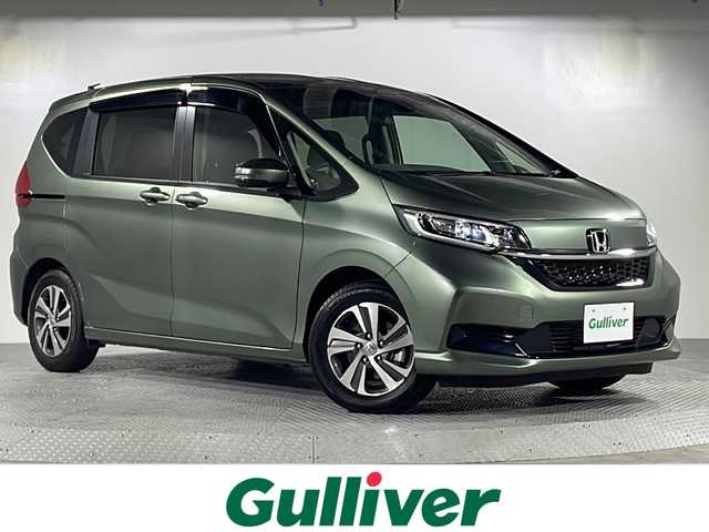 ホンダ フリード ハイブリット G 沖縄県 2023(令5)年 0.2万km シルバーミストグリーンM 県外仕入/禁煙車　/6人乗り/純正SDナビ/CD/SD/BT/バックカメラ/ホンダセンシング/衝突軽減ブレーキ/レーンキープアシスト/アダプティブクルーズコントロール/横滑り防止装置/両側パワースライドドア/ハーフレザーシート/前席シートヒーター/LEDヘッドライト/オートライト/純正15インチAW/純正フロアマット/プッシュスタート/スマートキー