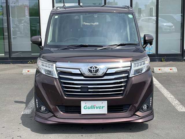トヨタ ルーミー カスタムG 道東・釧路十勝 2018(平30)年 6.9万km プラムブラウンパールクリスタルシャイン ・４WD/・純正9インチナビ/（CD・DVD・AM・FM・SD・BT）/・バックカメラ/・両側パワースライドドア/・純正ドライブレコーダー/・社外ドライブレコーダー/・横滑り防止装置/・フロントフォグライト/・アイドリングストップ/・電動格納ミラー/・スマートキー/・プッシュスタート/・ステアリングスイッチ/・ドアバイザー/・純正フロアマット/・オートライト/・ウィンカーミラー/・リアサンシェード/・純正フロントスポイラー