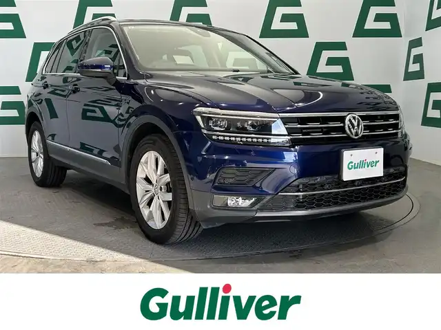 フォルクスワーゲン ティグアン TDI 4モーション ハイライン 鹿児島県 2019(令1)年 3.2万km アトランティックブルーメタリック 禁煙車/純正ナビ/　・Bluetooth/　・CD/DVD/　・AppleCarplay/　・AndroidAuto/　・SDカード/　・フルセグTV/全周囲カメラ/ブラインドスポットモニター/ヘッドアップディスプレイ/電動パーキングブレーキ/オートブレーキホールド/3ゾーンフルオートエアーコンディショナー/(運転席/助手席/後席独立調整、自動内気循環機能付)/運転席メモリーシート/全席シートヒーター/ビルトインETC2.0/電動リアゲート/電動格納ミラー/純正アルミホイール/LEDヘッドライト/フォグランプ/ワンオーナー