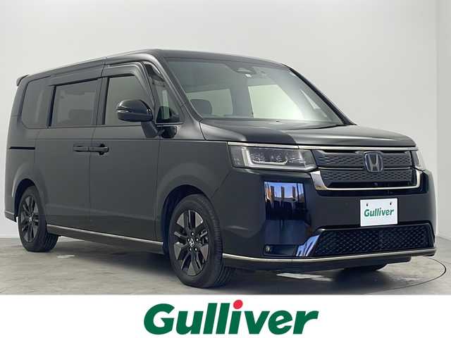 ホンダ ステップワゴン スパーダ eHEV 大阪府 2022(令4)年 5.4万km クリスタルブラックパール 純正９インチナビ/【BT/フルセグTV/USB/AppleCarPlay/AndroidAuto]/純正15.6インチ後席モニター/全方位カメラ/ETC/ドライブレコーダー前後/両側パワースライドドア/ブラインドスポットモニター/衝突被害軽減システム/クルーズコントロール追従/オートライト/コーナーセンサー前後/オットマン/シートバックテーブル/ハーフレザーシート/純正16インチＡＷ/純正フロアマット