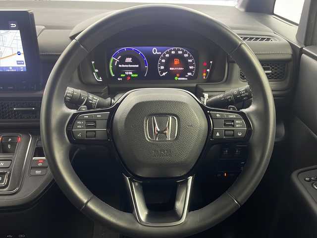 ホンダ ステップワゴン スパーダ eHEV 大阪府 2022(令4)年 5.4万km クリスタルブラックパール 純正９インチナビ/【BT/フルセグTV/USB/AppleCarPlay/AndroidAuto]/純正15.6インチ後席モニター/全方位カメラ/ETC/ドライブレコーダー前後/両側パワースライドドア/ブラインドスポットモニター/衝突被害軽減システム/クルーズコントロール追従/オートライト/コーナーセンサー前後/オットマン/シートバックテーブル/ハーフレザーシート/純正16インチＡＷ/純正フロアマット