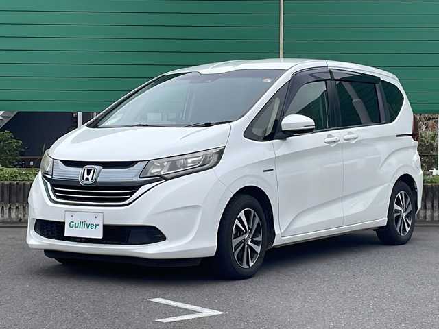 ホンダ フリード ハイブリット G ホンダセンシング 茨城県 2017(平29)年 7.1万km ホワイトオーキッドパール ワンオーナー/純正SDナビ/バックカメラ/Bluetooth接続/ビルトインETC/横滑り防止装置/レーンキープアシスト/衝突軽減システム/オートライト/LEDヘッドライト/両側パワースライドドア/ハーフレザー/純正フロアマット/純正15インチアルミホイール/ウォークスルー/保証書/取扱説明書/記録簿