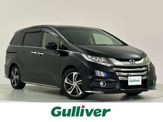 ホンダ オデッセイ アブソルート アドバンス 大阪府 2016(平28)年 7万km クリスタルブラックパール Honda SENSING/・衝突軽減ブレーキ/・歩行者事故低減ステアリング/・アダプティブクルーズコントロール/・車線維持支援システム/・路外逸脱抑制機能/・誤発進抑制機能/・先行車発進告知機能/純正ナビ/　CD/DVD/BT/フルセグTV/マルチビューカメラシステム/フロント・サイド・バックカメラ/両側パワースライドドア/オートLEDヘッドライト/フォグランプ/ハーフレザーシート/D席パワーシート/純正17インチアルミホイール/パドルシフト/スマートキー/ETC/2列目オットマン/アイドリングストップ/電動格納ミラー/フロアマット