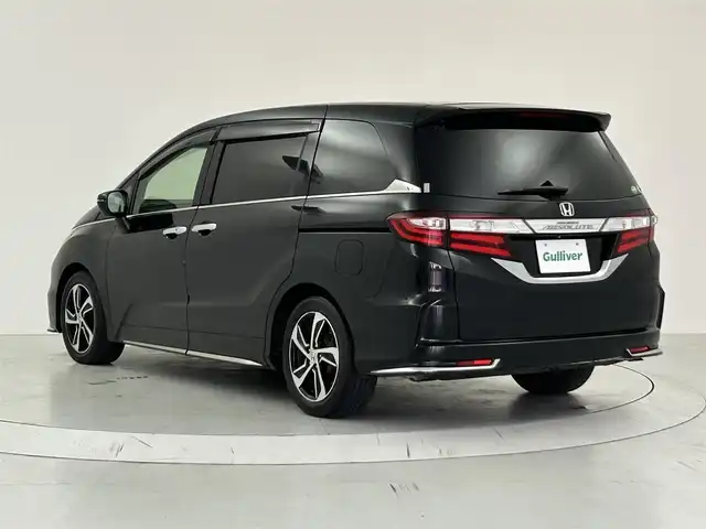 ホンダ オデッセイ アブソルート アドバンス 大阪府 2016(平28)年 7万km クリスタルブラックパール Honda SENSING/・衝突軽減ブレーキ/・歩行者事故低減ステアリング/・アダプティブクルーズコントロール/・車線維持支援システム/・路外逸脱抑制機能/・誤発進抑制機能/・先行車発進告知機能/純正ナビ/　CD/DVD/BT/フルセグTV/マルチビューカメラシステム/フロント・サイド・バックカメラ/両側パワースライドドア/オートLEDヘッドライト/フォグランプ/ハーフレザーシート/D席パワーシート/純正17インチアルミホイール/パドルシフト/スマートキー/ETC/2列目オットマン/アイドリングストップ/電動格納ミラー/フロアマット