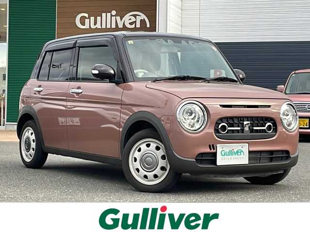 スズキ ラパン ＬＣ X 佐賀県 2023(令5)年 1.1万km テラコッタピンクメタリック/アーバンブラウン 2トーン エンジンスタートボタン/保証書/取扱説明書/記録簿/ワンオーナー/アイドリングストップ/スマートキー/スペアキー有/Bluetooth接続/CD/TV/社外ナビ/前後ドライブレコーダー/ベンチシート/純正フロアマット/前席シートヒーター/ABS/前後コーナーセンサー/LEDライト/レーンキープアシスト/盗難防止装置/オートライト/Wエアバッグ/衝突被害軽減システム/ステアリングスイッチ/クリアランスソナー/電格ウィンカーミラー