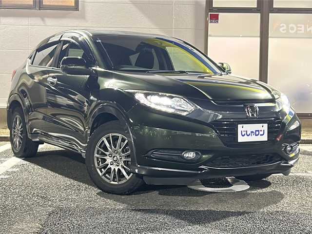 ホンダ ヴェゼル ハイブリッド X 東京都 2015(平27)年 8.2万km ミスティックグリーンパール (株)IDOMが運営する【じしゃロン伏見店】の自社ローン専用車両になりますこちらは現金またはオートローンご利用時の価格です。自社ローンご希望の方は別途その旨お申付け下さい/ホンダインターナビ/ワンセグテレビ/Bluetooth接続/USB×2/HDMI/前席シートヒーター/7速デュアルクラッチ付き/プッシュパーキングブレーキ/ブレーキホールド/LEDヘッドライト/衝突被害軽減システム/クルーズコントロール/ETC/純正アルミホイール積み込み