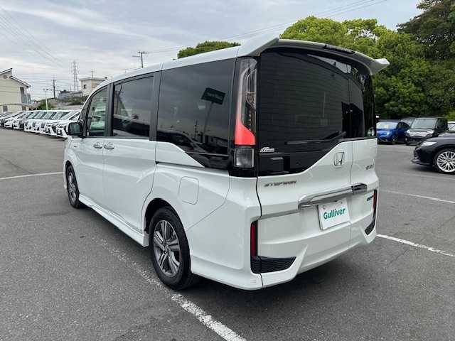 ホンダ ステップワゴン スパーダ ハイブリッド G EX ホンダセンシング 大阪府 2019(平31)年 1.8万km プラチナホワイトパール 純正９インチナビ　/フルセグ　/Ｂｌｕｅｔｏｏｔｈ　/全方位カメラ　/両側パワースライドドア　/レザーシート　/シートヒーター　/エアーシート　/ＡＣ１００Ｖ　/前後ドライブレコーダー　/レーダークルーズコントロール/前後コーナーセンサー