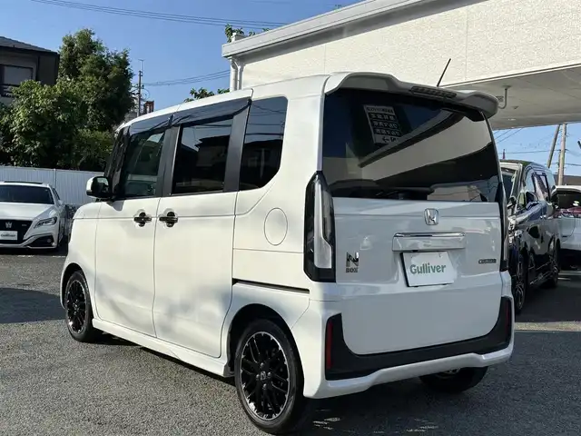 ホンダ Ｎ ＢＯＸ カスタム ターボ コーディネートS 熊本県 2024(令6)年 2.7万km プラチナホワイトパール ワンオーナー/社外10インチフローティングナビ（CN-F1X10BD）/【フルセグTV/CD/DVD/ＢＤ/Bluetooth/ラジオ】/バックカメラ/両側パワースライドドア/レーダークルーズコントロール/衝突軽減ブレーキ/先行車発進お知らせ機能/車線維持支援システム/標識認識機能/パドルシフト/横滑り防止機能/ブレーキホールド/黒革シート/前席シートヒーター/純正15インチAW/オートライト/LEDヘッドライト/ベンチシート/リヤサンシェード/ISOFIX/保証書/取扱説明書