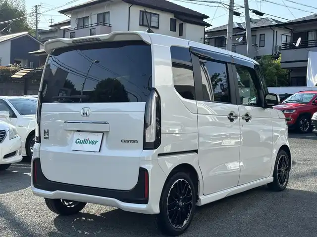 ホンダ Ｎ ＢＯＸ カスタム ターボ コーディネートS 熊本県 2024(令6)年 2.7万km プラチナホワイトパール ワンオーナー/社外10インチフローティングナビ（CN-F1X10BD）/【フルセグTV/CD/DVD/ＢＤ/Bluetooth/ラジオ】/バックカメラ/両側パワースライドドア/レーダークルーズコントロール/衝突軽減ブレーキ/先行車発進お知らせ機能/車線維持支援システム/標識認識機能/パドルシフト/横滑り防止機能/ブレーキホールド/黒革シート/前席シートヒーター/純正15インチAW/オートライト/LEDヘッドライト/ベンチシート/リヤサンシェード/ISOFIX/保証書/取扱説明書