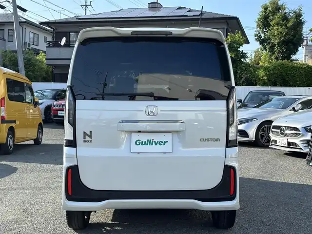 ホンダ Ｎ ＢＯＸ カスタム ターボ コーディネートS 熊本県 2024(令6)年 2.7万km プラチナホワイトパール ワンオーナー/社外10インチフローティングナビ（CN-F1X10BD）/【フルセグTV/CD/DVD/ＢＤ/Bluetooth/ラジオ】/バックカメラ/両側パワースライドドア/レーダークルーズコントロール/衝突軽減ブレーキ/先行車発進お知らせ機能/車線維持支援システム/標識認識機能/パドルシフト/横滑り防止機能/ブレーキホールド/黒革シート/前席シートヒーター/純正15インチAW/オートライト/LEDヘッドライト/ベンチシート/リヤサンシェード/ISOFIX/保証書/取扱説明書