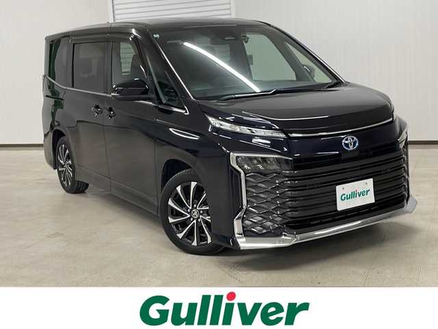 トヨタ ヴォクシー ハイブリッド S－Z 熊本県 2022(令4)年 1.7万km スパークリングブラックパールクリスタルシャイン 禁煙車/トヨタセーフティセンス/・プリクラッシュセーフティ/・レーントレーシングアシスト/・ロードサインアシスト/・オートマチックハイビーム/・レーダークルーズコントロール/8型ディスプレイオーディオ/ナビ機能/CD/DVD/BT/USB/フルセグTV/両側パワースライドドア/バックカメラ/純正フリップダウンモニター/ハーフレザー/前席シートヒーター/ビルトインETC2.0/LEDヘッドライト/AC100V/純正ドアバイザー