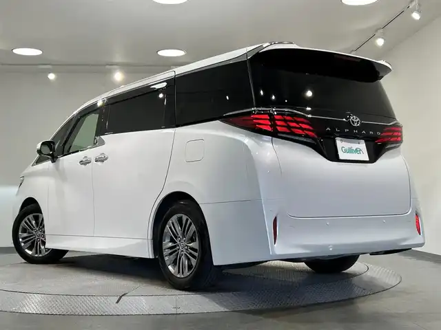 トヨタ アルファード Z 愛知県 2024(令6)年 2.1万km プラチナホワイトパールマイカ 純正14インチディスプレイ/左右独立ムーンルーフ/寒冷地仕様/パノラミックビューモニター/ヘッドアップディスプレイ/純正13.2インチフリップダウンモニター/両側電動スライドドア/パワーバックドア/ワイヤレス充電/デジタルインナーミラー/ビルトイン2.0/シートヒーター/シートクーラー/シートメモリー/ハンドルヒーター/後席用パワーサイドサンシェード/アクセサリーソケット/プリクラッシュセーフティ/レーンディパーチャーアラート/プロアクティブドライビングアシスト/ブラインドスポットモニター/クリアランスソナー/純正18インチアルミホイール/純正フロアマット