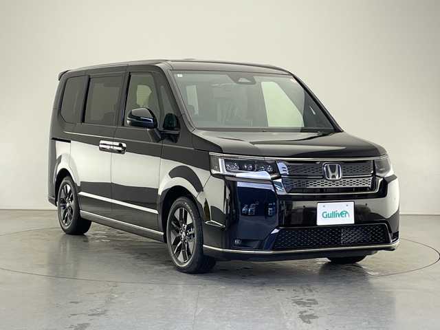 ホンダ ステップワゴン スパーダ eHEV 長野県 2025(令7)年 0.1千km クリスタルブラックパール 届出済未使用車/純正メモリナビ&フルセグTV&CD&DVD&USB&BT/ホンダセンシング/アダプティブクルーズコントロール/レーンキープアシスト/衝突軽減ブレーキ/ブラインドスポットインフォメーション/クリアランスソナー/標識認識表示/両側パワースライドドア/パワーバックドア/ハーフレザーシート/前席シートヒーター/ステアリングスイッチ/パドルシフト/2列目オットマン/2列目サンシェード/バックカメラ/LEDヘッドライト/オートライト/フロントフォグランプ/電動格納ミラー/ウィンカーミラー/電動ホールド/ブレーキホールド/純正16インチAW装着/プッシュスタート/スマートキー/スペアキー1本/取扱説明書/新車保証書