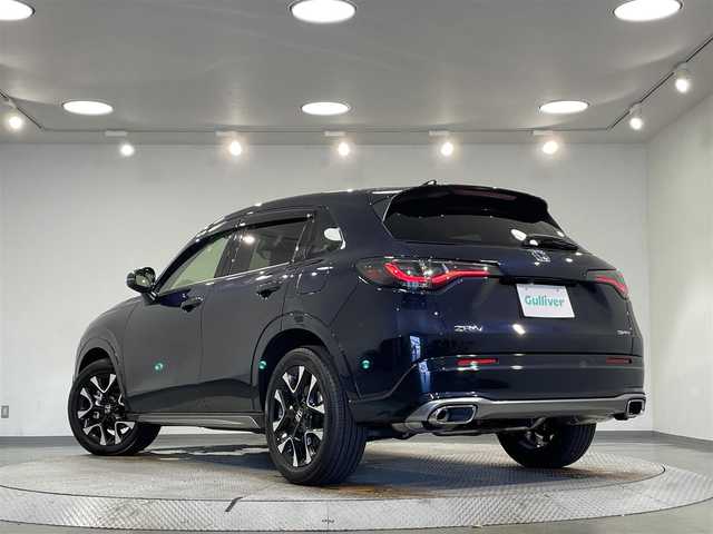 ホンダ ＺＲ－Ｖ ハイブリッド e:HEV Z 愛知県 2024(令6)年 1.1万km ミッドナイトブルービームM 純正９インチディスプレイナビ　/（FM/AM/USB/Bluetooth/スマホ連載/フルセグTV)/純正エアロ（Ｆ／Ｓ）/マルチビューカメラシステム　/ホンダセンシング　/　　-衝突軽減ブレーキ/　　-誤発進抑制機能/　　-アダプティブクルーズコントロール/　　-車線維持支援システム/　　-先行車発進お知らせ機能/　　-標識認識機能/　　-オートハイビーム/　　-ブラインドスポットインフォメーション/ビルトインＥＴＣ２．０　/シートヒーター　/LEDヘッドライト/LEDフォグランプ/ワイヤレス充電　/電動バックドア　/ドライブレコーダー　/メモリー機能付きパワーシート　/ステアリングヒーター/パドルシフト/純正フロアマット