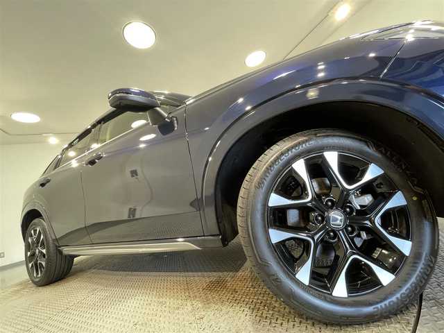 ホンダ ＺＲ－Ｖ ハイブリッド e:HEV Z 愛知県 2024(令6)年 1.1万km ミッドナイトブルービームM 純正９インチディスプレイナビ　/（FM/AM/USB/Bluetooth/スマホ連載/フルセグTV)/純正エアロ（Ｆ／Ｓ）/マルチビューカメラシステム　/ホンダセンシング　/　　-衝突軽減ブレーキ/　　-誤発進抑制機能/　　-アダプティブクルーズコントロール/　　-車線維持支援システム/　　-先行車発進お知らせ機能/　　-標識認識機能/　　-オートハイビーム/　　-ブラインドスポットインフォメーション/ビルトインＥＴＣ２．０　/シートヒーター　/LEDヘッドライト/LEDフォグランプ/ワイヤレス充電　/電動バックドア　/ドライブレコーダー　/メモリー機能付きパワーシート　/ステアリングヒーター/パドルシフト/純正フロアマット