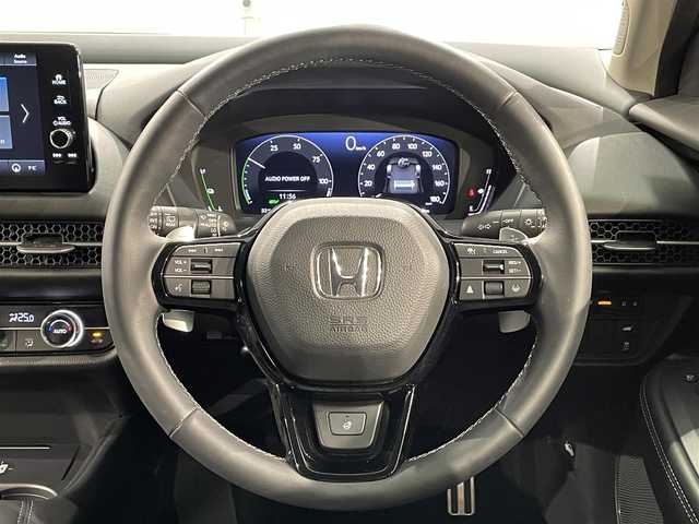 ホンダ ＺＲ－Ｖ ハイブリッド e:HEV Z 愛知県 2024(令6)年 1.1万km ミッドナイトブルービームM 純正９インチディスプレイナビ　/（FM/AM/USB/Bluetooth/スマホ連載/フルセグTV)/純正エアロ（Ｆ／Ｓ）/マルチビューカメラシステム　/ホンダセンシング　/　　-衝突軽減ブレーキ/　　-誤発進抑制機能/　　-アダプティブクルーズコントロール/　　-車線維持支援システム/　　-先行車発進お知らせ機能/　　-標識認識機能/　　-オートハイビーム/　　-ブラインドスポットインフォメーション/ビルトインＥＴＣ２．０　/シートヒーター　/LEDヘッドライト/LEDフォグランプ/ワイヤレス充電　/電動バックドア　/ドライブレコーダー　/メモリー機能付きパワーシート　/ステアリングヒーター/パドルシフト/純正フロアマット