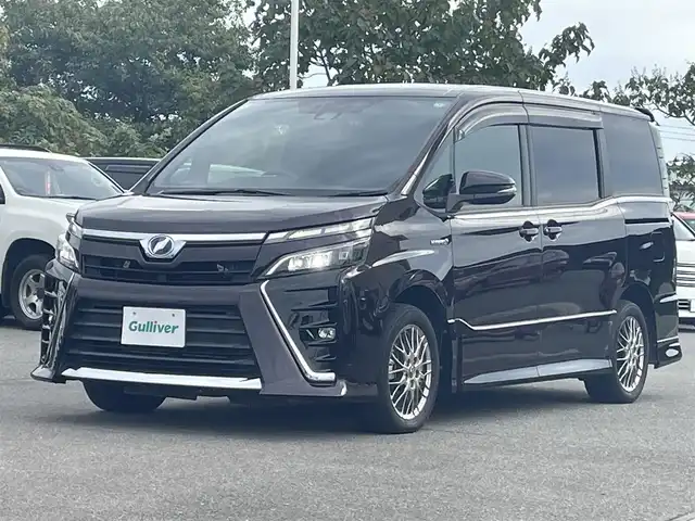 トヨタ ヴォクシー ハイブリッド ZS 山形県 2017(平29)年 8.8万km ボルドーマイカメタリック 衝突軽減/フリップダウンモニター/純正SDナビ/　　【CD　BT　フルセグ　USB 】/バックカメラ/両側パワースライドドア/クルーズコントロール/LEDオートライト/オートハイビーム/シートヒーター/純正16インチアルミホイール/レーンキープアシスト/純正フロアマット/ステアリングスイッチ/スマートキー/ETC