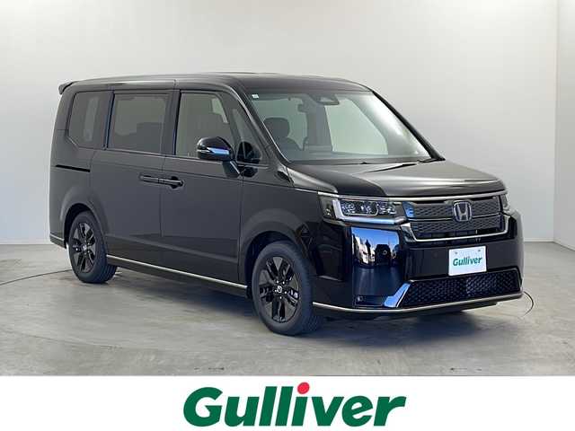 ホンダ ステップワゴン スパーダ eHEV 栃木県 2025(令7)年 0.1千km クリスタルブラックパール 登録済未使用車/純正11.4型ナビ/（CD/DVD/Bluetooth/フルセグ）/バックカメラ/Honda CONNECT for Gathers＋ナビ装着用スペシャルパッケージ/Honda SENSING/●衝突軽減ブレーキ（CMBS）/●先行車発進お知らせ機能/●歩行者事故低減ステアリング/●路外逸脱抑制機能/●標識認識機能/●渋滞追従機能付アダプティブクルーズコントロール（ACC）/●車線維持支援システム（LKAS）/●トラフィックジャムアシスト（渋滞運転支援機能）/●誤発進抑制機能/●後方誤発進抑制機能/●近距離衝突軽減ブレーキ/●急アクセル抑制機能/●パーキングセンサーシステム/●後退出庫サポート/ブラインドスポットインフォメーション/パワーテールゲート(メモリー機能付)/2列目オットマン/運転席＆助手席シートヒーター/トリプルゾーンコントロール・フルオートエアコンディショナー/コンビシート/16インチアルミホイール(SPADA専用)/減速セレクター/全列USBチャージャー