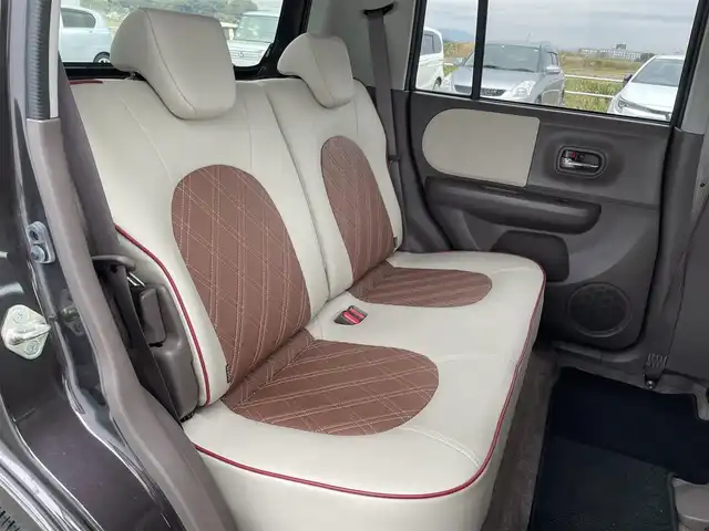 スズキ ラパン ショコラ G 佐賀県 2015(平27)年 1万km アーバンブラウンパールメタリック 社外SDナビゲーション/・ワンセグTV/AM/FM/CD/アイドリングストップ/ブラウンレザーシート(合皮)/ISOFIX対応/プッシュスタート/スマートキー/革巻きステアリング/純正キセノンヘッドライト/ドアバイザ―/取扱説明書/スペアキー１本