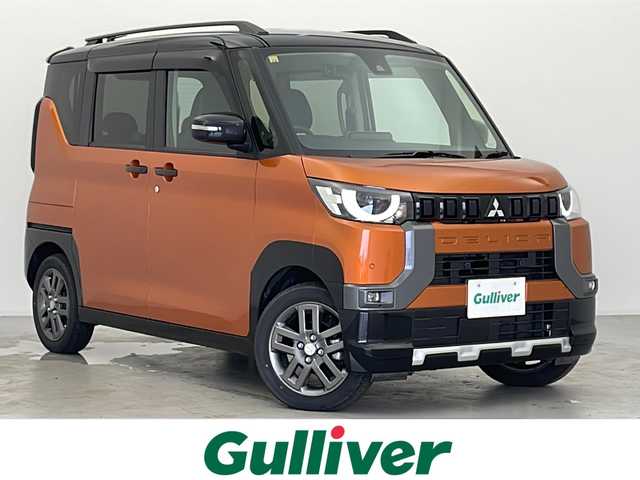 三菱 デリカミニ T プレミアム 宮城県 2023(令5)年 0.8万km オレンジ ４ＷＤ　/純正９インチナビ(AM/FM/BT/フルセグTV)/全方位モニター　/両側パワースライドドア　/デジタルインナーミラー/IC付ターボ　/ｅ－Ａｓｓｉｓｔ　/　・レーダークルーズコントロール　/　・車線維持支援機能　/　・衝突被害軽減ブレーキシステム/　・踏み間違い衝突防止アシスト/　・標識認識システム/　・先行車発進通知/　・ふらつき警報/　・横滑り防止装置/　・ヒルスタートアシスト/　・オートマチックハイビーム/オートライト/LEDライト/ヘッドライトレベライザー/フォグランプ/電動パーキングブレーキ/前後コーナーセンサー/純正アルミホイール/サイドバイザー/ステアリングスイッチ/レザーステアリング/ハーフレザーシート/プッシュスタート/スマートキー