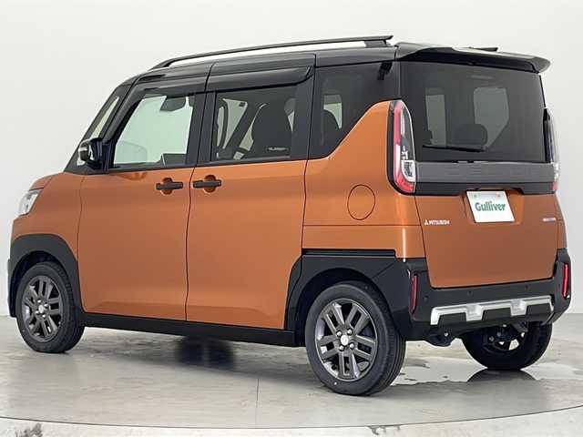 三菱 デリカミニ T プレミアム 宮城県 2023(令5)年 0.8万km オレンジ ４ＷＤ　/純正９インチナビ(AM/FM/BT/フルセグTV)/全方位モニター　/両側パワースライドドア　/デジタルインナーミラー/IC付ターボ　/ｅ－Ａｓｓｉｓｔ　/　・レーダークルーズコントロール　/　・車線維持支援機能　/　・衝突被害軽減ブレーキシステム/　・踏み間違い衝突防止アシスト/　・標識認識システム/　・先行車発進通知/　・ふらつき警報/　・横滑り防止装置/　・ヒルスタートアシスト/　・オートマチックハイビーム/オートライト/LEDライト/ヘッドライトレベライザー/フォグランプ/電動パーキングブレーキ/前後コーナーセンサー/純正アルミホイール/サイドバイザー/ステアリングスイッチ/レザーステアリング/ハーフレザーシート/プッシュスタート/スマートキー