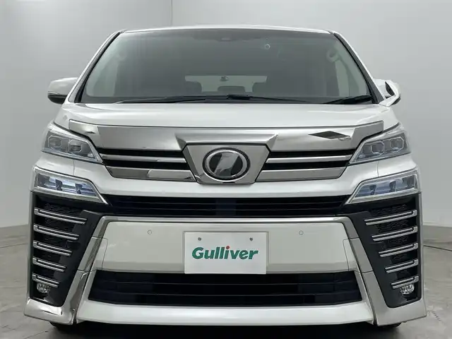 トヨタ ヴェルファイア Z Gエディション 岡山県 2019(平31)年 6万km ホワイトパールクリスタルシャイン 純正１０インチナビ/【Bluetooth/フルセグTV/CD/DVD】/合皮シート/衝突軽減ブレーキ/両側電動スライドドア/レーダークルーズコントロール/ビルトインＥＴＣ/ＬＥＤヘッドライト/前席シートヒーター/前席エアシート/ステアリングヒーター/バックカメラ/社外ドライブレコーダー（前後）/ブラインドスポットモニター/純正フロアマット/踏み間違い防止/レーンアシスト/横滑り防止/オートブレーキホールド/TVキャンセラー/ISOFIX/後席サンシェイド/ステアリングスイッチ/チルトステアリング/シートリフター/ウインカーミラー/ドアバイザー