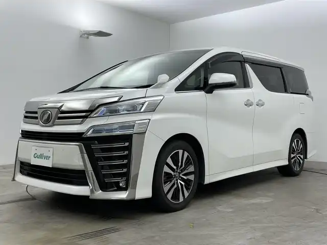 トヨタ ヴェルファイア Z Gエディション 岡山県 2019(平31)年 6万km ホワイトパールクリスタルシャイン 純正１０インチナビ/【Bluetooth/フルセグTV/CD/DVD】/合皮シート/衝突軽減ブレーキ/両側電動スライドドア/レーダークルーズコントロール/ビルトインＥＴＣ/ＬＥＤヘッドライト/前席シートヒーター/前席エアシート/ステアリングヒーター/バックカメラ/社外ドライブレコーダー（前後）/ブラインドスポットモニター/純正フロアマット/踏み間違い防止/レーンアシスト/横滑り防止/オートブレーキホールド/TVキャンセラー/ISOFIX/後席サンシェイド/ステアリングスイッチ/チルトステアリング/シートリフター/ウインカーミラー/ドアバイザー