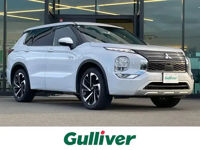 三菱 アウトランダー ＰＨＥＶ P 東京都 2024(令6)年 0.4万km ホワイトダイヤモンド 電動パノラマサンルーフ/BOSEサウンド/ e-Assist/・衝突被害軽減ブレーキシステム/・踏み間違い衝突防止アシスト/・車線逸脱防止支援機能/・ブラインドスポットアシスト/・ヘッドアップディスプレイ/・マイパイロット/・マルチアラウンドモニター/純正ナビ/フルセグTV/ワイヤレス充電器/セミアニリンレザーシート/メモリー機能付きパワーシート/ランバーサポート (リフレッシュ機能)/シートヒーター/ステアリングヒーター/エレクトリックテールゲート/後席ロールサンシェード/アダプティブLEDヘッドライト/20インチ純正アルミホイール/スマートキー