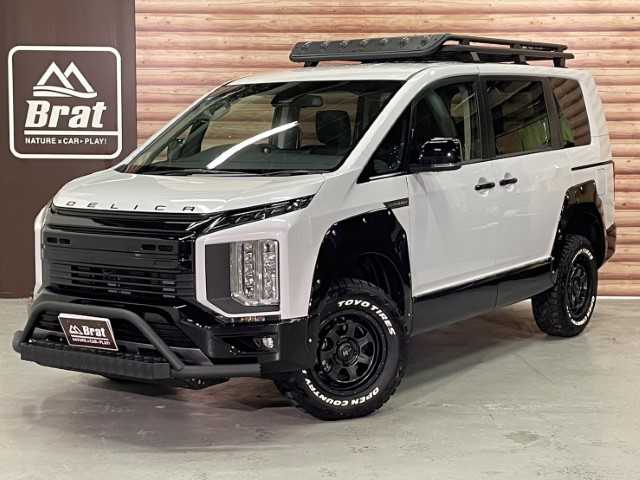 三菱 デリカＤ：５ シャモニー 栃木県 2025(令7)年 0.1千km 白Ⅱ AIS検査済み/【2506028454】/純正アルパインナビ/12.8型フリップダウンモニター/フルセグ/全方位カメラ/ステアリングリモコン/両側パワースライドドア/パワーバックドア/ステアリングヒーター/レーダークルーズ/前席シートヒーター/ハーフレザーシート/パドルシフト/ブラインドスポットモニター/アイドリングストップ/ウィンカーミラー/運転席パワーシート/AC100V電源/スマートキー/ナイトロパワー　M7ファランクス（社外）/TOYOオープンカントリーR/T　（社外）/Bratオリジナルリフトアップキット（社外）/MADLYS　フロントグリル（社外）/MADLYS　ブルバー（社外）/MADLYS　フェンダープロテクター（社外）/ヘッドライトシャドウシート（社外）/ルーフラック（社外）/社外パーツ取付有