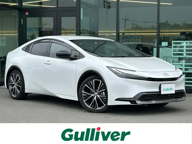 トヨタ プリウス Z 東京都 2023(令5)年 2.8万km プラチナホワイトパールマイカ Toyota Safety Sense/・レーンディパーチャーアラート/・先行車発進告知機能/・オートマチックハイビーム/・レーダークルーズコントロール/・クリアランスソナー/・パーキングサポートブレーキ/・ブラインドスポットモニター/・パノラミックビューモニター/純正ナビ/フルセグTV/ドライブレコーダー/パワーシート/エアシート/シートヒーター/ベンチレーションシート/ステアリングヒーター/ワイヤレス充電器/ETC2.0/LEDヘッドライト/19インチ純正アルミホイール/純正フロアマット