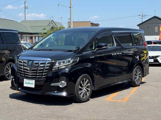トヨタ アルファードハイブリット SR 道東・釧路十勝 2015(平27)年 9.6万km ブラック 4WD/純正メモリーナビ/　　（DVD/CD/フルセグTV/Bluetooth）/バックカメラ/純正フリップダウンモニター/衝突軽減ブレーキ/レーダークルーズコントロール/パワーバックドア/前席パワーシート/両側パワースライドドア/ハーフレザーシート/ウッドコンビハンドル/ステアリングリモコン/横滑り防止装置/LEDヘッドライト/フォグライト/ウィンカーミラー/電動格納ミラー/オットマンシート（助手席/2列目）/ドライブレコーダー/ビルトインETC/JBLサウンドシステム/ドアバイザー/純正フロアマット/スマートキー/エンジンプッシュスタート/スペアキー/取扱説明書/保証書/ナビ取説/純正17インチアルミホイール/冬タイヤ積み込み/　　（215/65R16、３mm、社外AW）