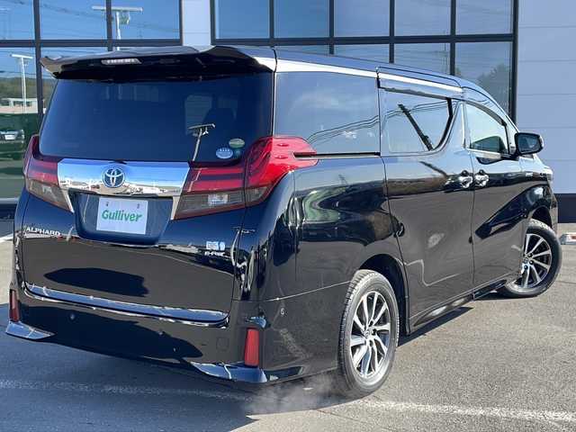 トヨタ アルファードハイブリット SR 道東・釧路十勝 2015(平27)年 9.6万km ブラック ・4WD/・純正9インチメモリナビ/（DVD・CD・フルセグ・Bluetooth・ラジオ・SD）/・バックカメラ/・純正10インチフリップダウンモニター/・JBLサウンドシステム/・衝突軽減ブレーキ/・レーダークルーズコントロール/・パワーバックドア/・前席パワーシート/・両側パワースライドドア/・ハーフレザーシート/・ウッドコンビハンドル/・ステアリングリモコン/・横滑り防止装置/・HIDヘッドライト/・フォグライト/・ウィンカーミラー/・電動格納ミラー/・オットマンシート（助手席/2列目）/・ドライブレコーダー/・ビルトインETC/・ドアバイザー/・純正フロアマット/・スマートキー/・エンジンプッシュスタート/・純正17インチアルミホイール