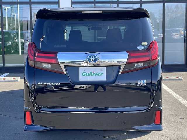 トヨタ アルファードハイブリット SR 道東・釧路十勝 2015(平27)年 9.6万km ブラック ・4WD/・純正9インチメモリナビ/（DVD・CD・フルセグ・Bluetooth・ラジオ・SD）/・バックカメラ/・純正10インチフリップダウンモニター/・JBLサウンドシステム/・衝突軽減ブレーキ/・レーダークルーズコントロール/・パワーバックドア/・前席パワーシート/・両側パワースライドドア/・ハーフレザーシート/・ウッドコンビハンドル/・ステアリングリモコン/・横滑り防止装置/・HIDヘッドライト/・フォグライト/・ウィンカーミラー/・電動格納ミラー/・オットマンシート（助手席/2列目）/・ドライブレコーダー/・ビルトインETC/・ドアバイザー/・純正フロアマット/・スマートキー/・エンジンプッシュスタート/・純正17インチアルミホイール