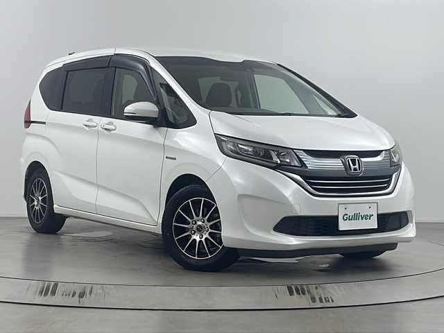 ホンダ フリード ハイブリット G ホンダセンシング 埼玉県 2017(平29)年 4.7万km ホワイトオーキッドパール 純正ナビ　MDV-D304/（ラジオ・ワンセグ・ＵＳＢ・ＣＤ・ＤＶＤ）/バックカメラ/ビルトインＥＴＣ/両側パワースライドドア/アダプティブクルーズコントロール/レーンキープアシスト/横滑り防止装置/盗難防止装置/衝突軽減/プッシュスタート/ステアリングリモコン/社外フロアマット/社外アルミホイール/ウィンカーミラー/LEDヘッドライト