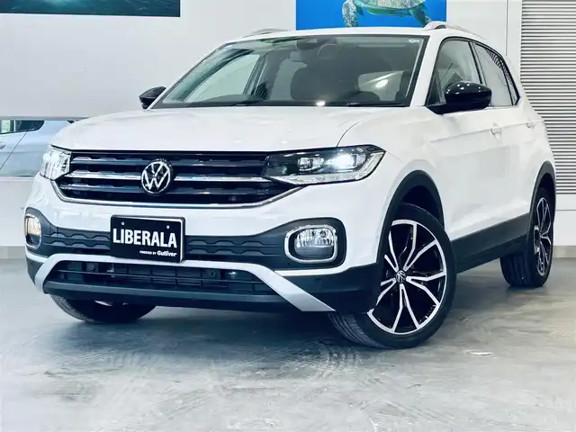 フォルクスワーゲン Ｔ－クロス TSI 1stプラス 大阪府 2021(令3)年 3.7万km 白 ワンオーナー/純正ナビ/TV/バックカメラ/applecarplay/ACC/ブラインドスポット/クリアランスソナー/パドルシフト/ハーフ革/ルーフレール/ワイヤレス充電/ETC/純正18インチAW/LEDヘッドライト