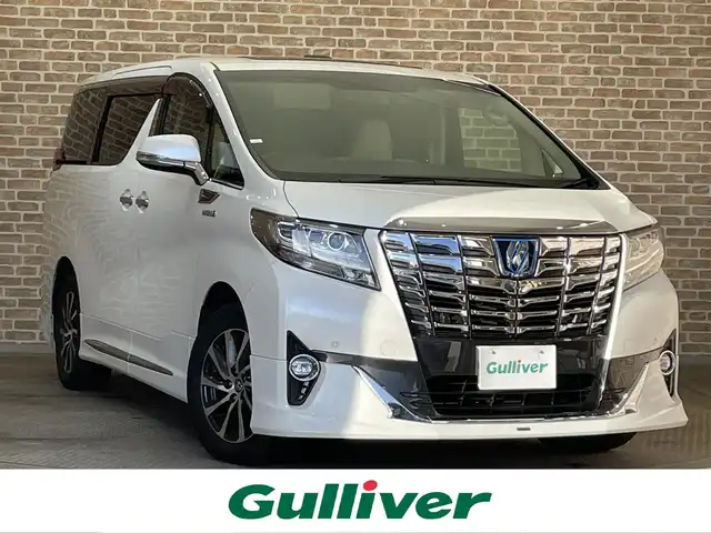 トヨタ アルファードハイブリット エグゼクティブ ラウンジ 岩手県 2015(平27)年 4.3万km ホワイトパールクリスタルシャイン ワンオーナー/４WD/JBLプレミアムサウンドシステム/モデリスタエアロ/サンルーフ/両側パワースライドドア/パワーバックドア/後席モニター/後席エアコン/100Ｖ電源/MTモード付AT/プリクラッシュセーフティ/クリアランスソナー/全周囲カメラ/横滑り防止装置/オートライト/オートハイビーム/アイドリングストップ/パワーシート/シートヒーター/エアシート/ステアリングヒーター/オールオートパワーウィンドウ/ステアリングスイッチ