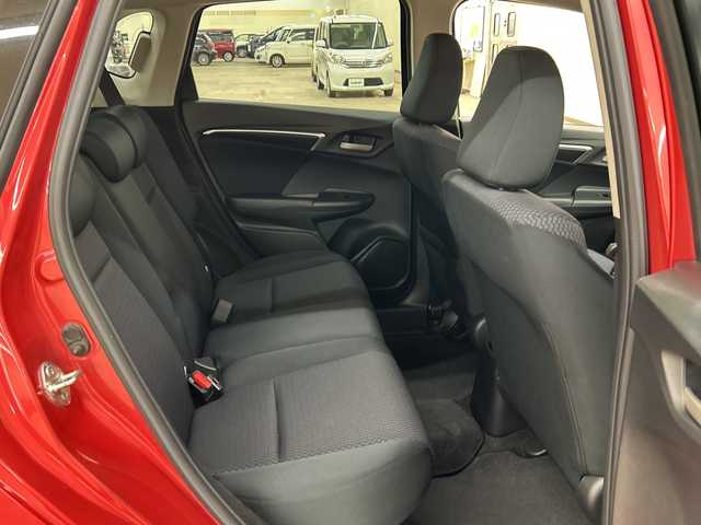 ホンダ フィット 13G F 道央・札幌 2018(平30)年 7.7万km プレミアムクリスタルレッドM ４WD//社外ナビ/　CD/BT/USB/ワンセグTV//バックカメラ//エンジンスターター//プッシュスタート//スマートキー//スペアキー//アイドリングストップ//ETC//社外15インチアルミ//冬タイヤ付き//電動格納ミラー
